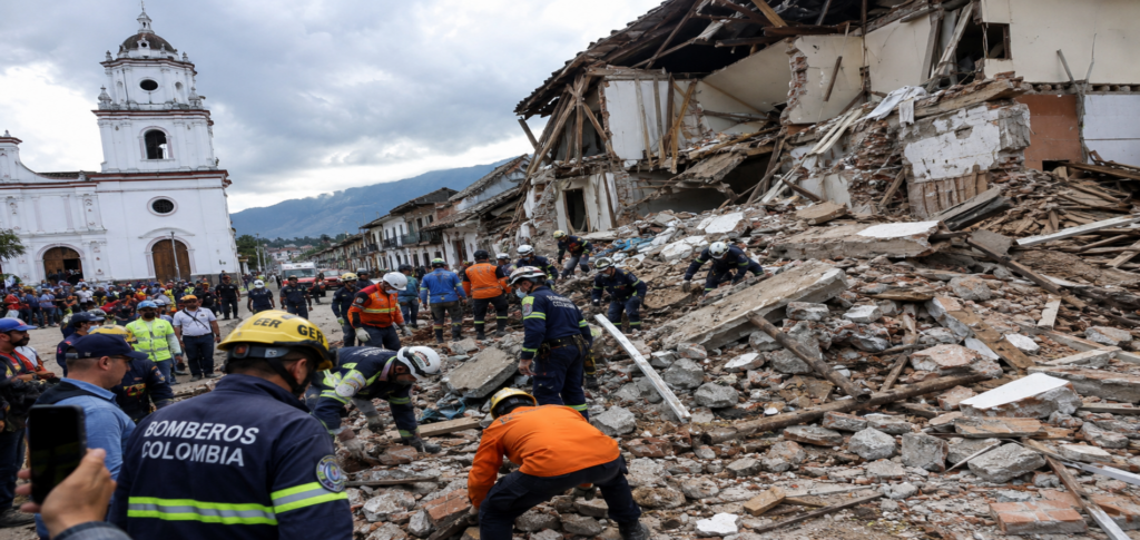 Colombia earthquake damage and rescue teams searching collapsed buildings