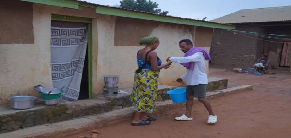 Congo Ebola outbreak frontline health worker disinfecting an Ebola treatment center while wearing full protective equipment in eastern Democratic Republic of Congo.