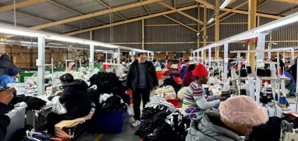 South African clothing factory workers operate sewing machines as manufacturers face labour shortages after migrant workers left during anti-immigration protests.