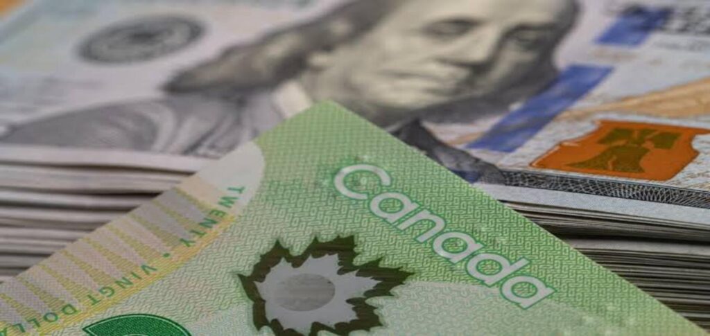 Canadian dollar falls to a 12-day low against the US dollar