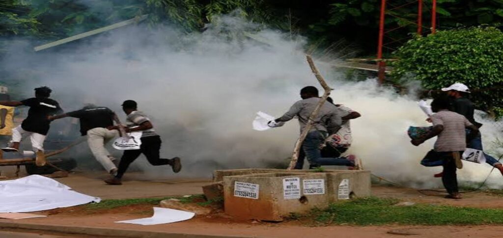 Nigerian police use tear gas during a protest over miner deaths in Niger state